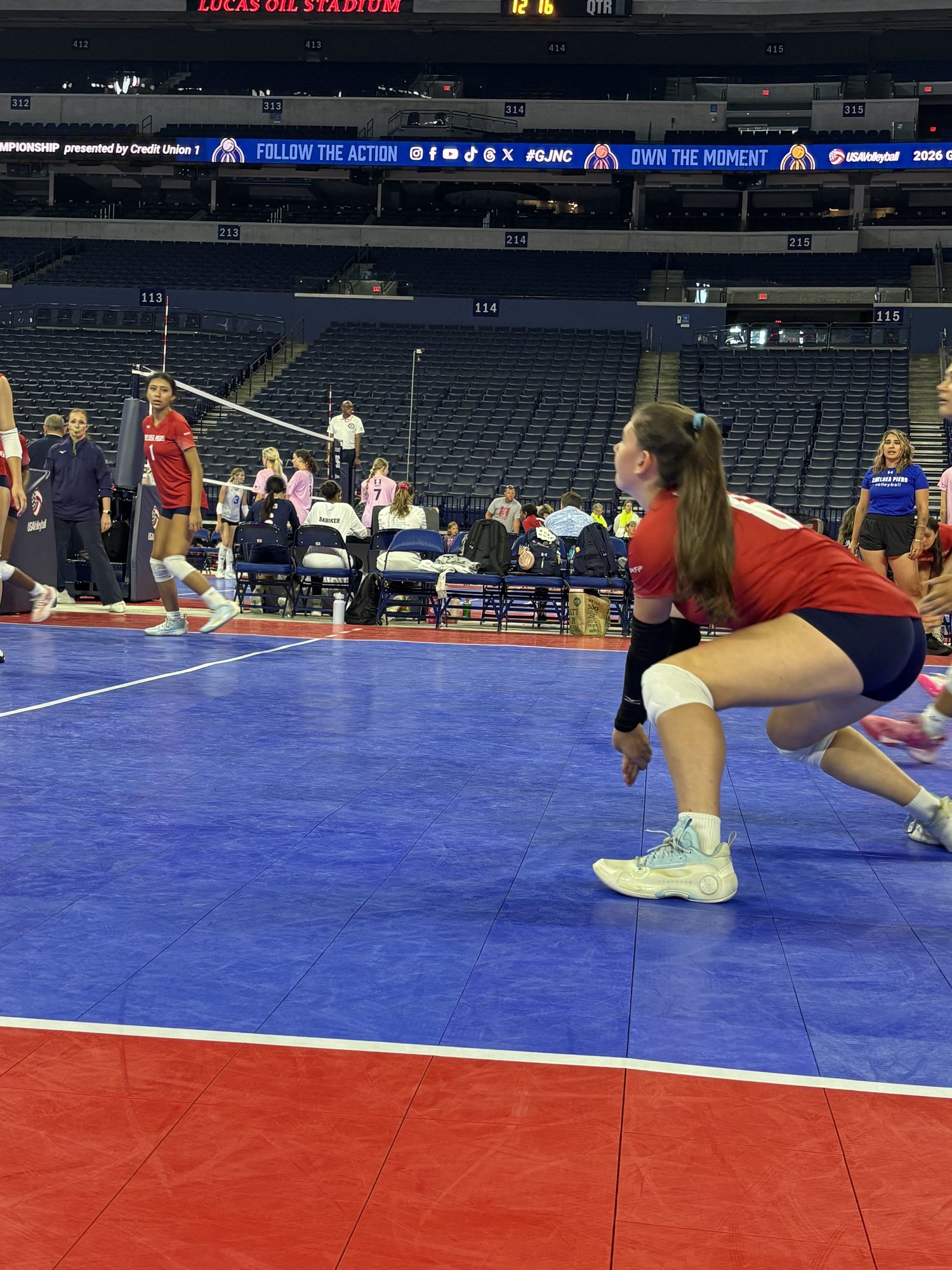 Low in the passing stance on the stadium court