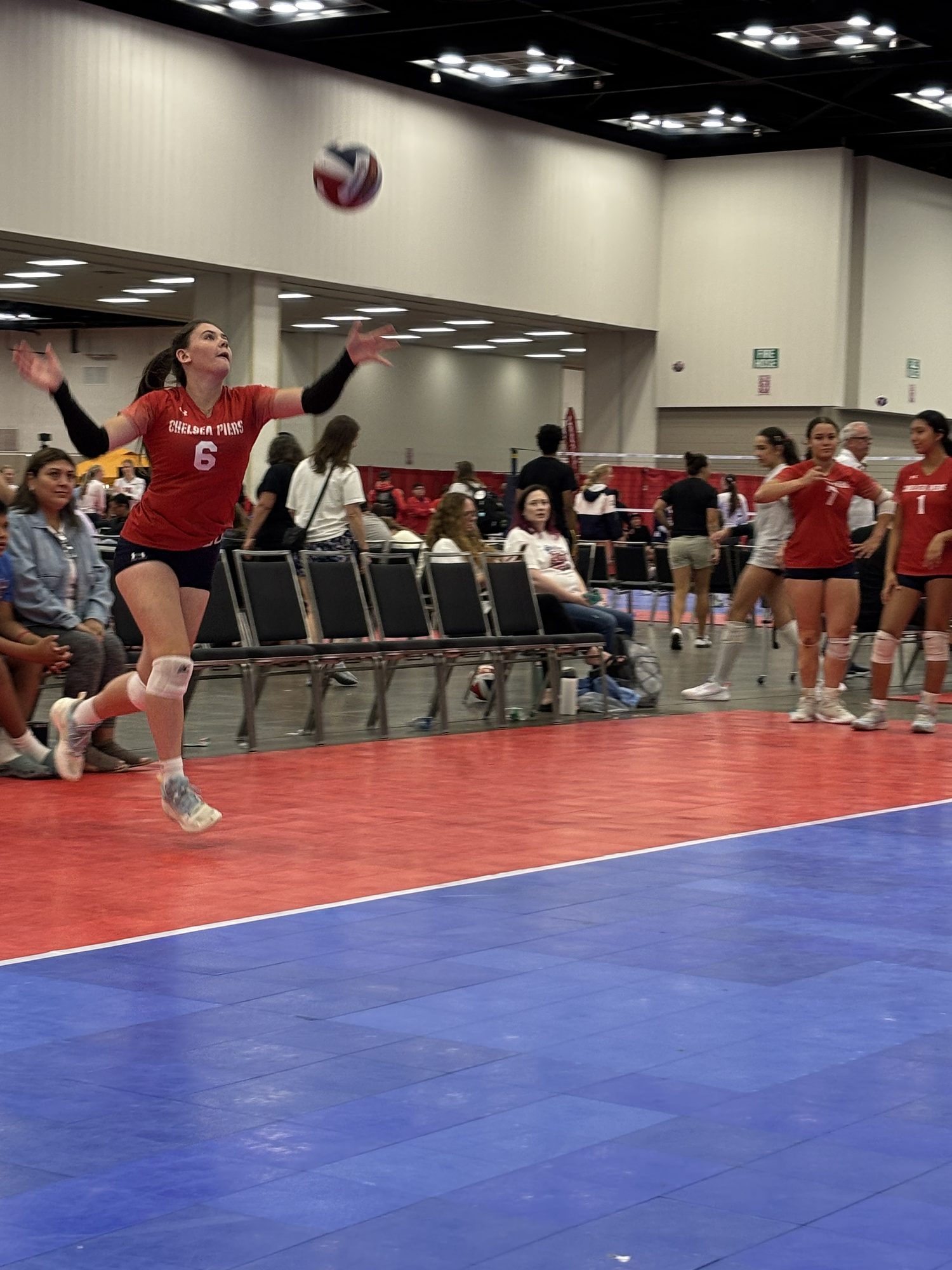Jump serve approach with the ball in the air