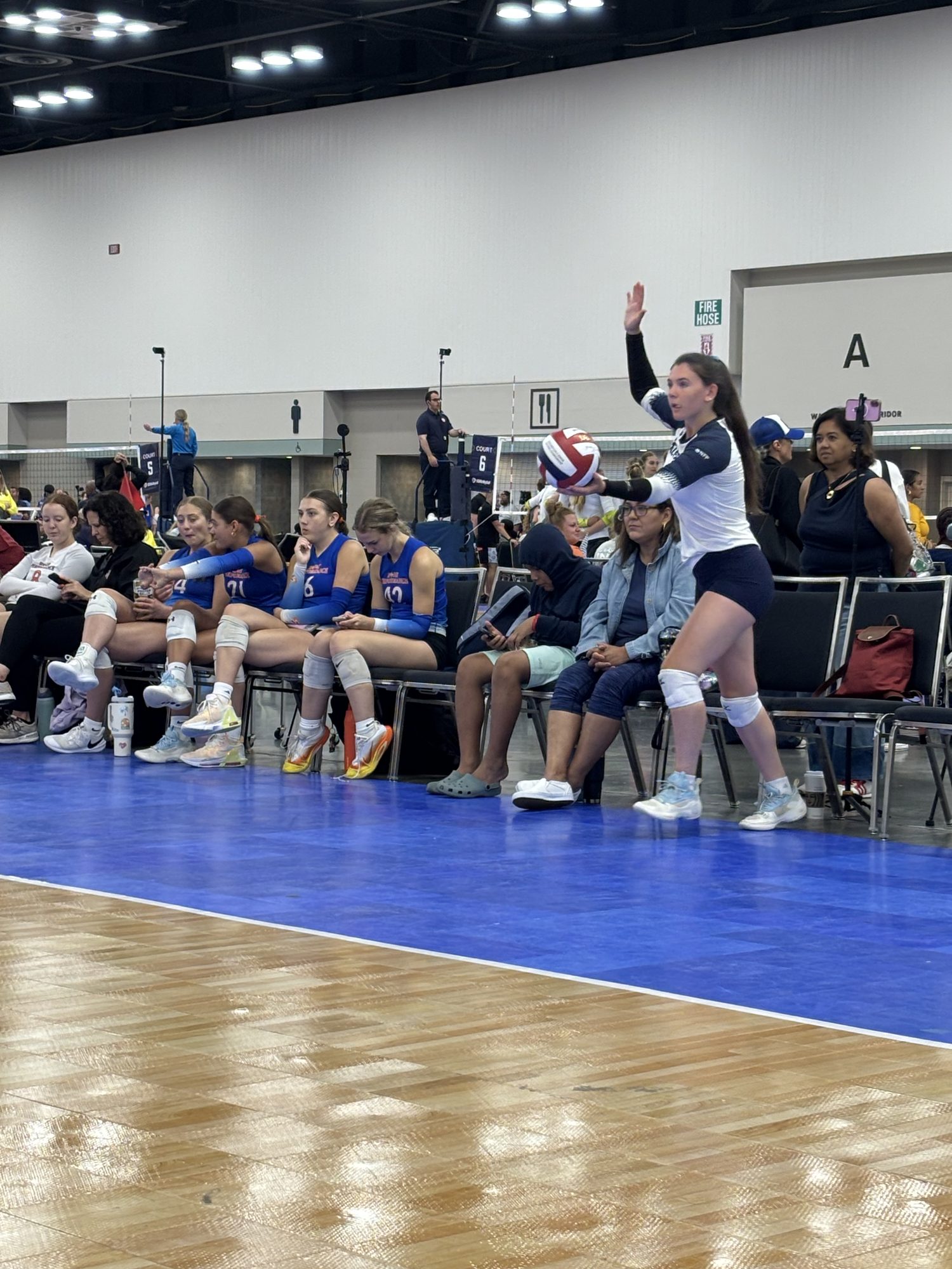 Waiting on the serve from the sideline